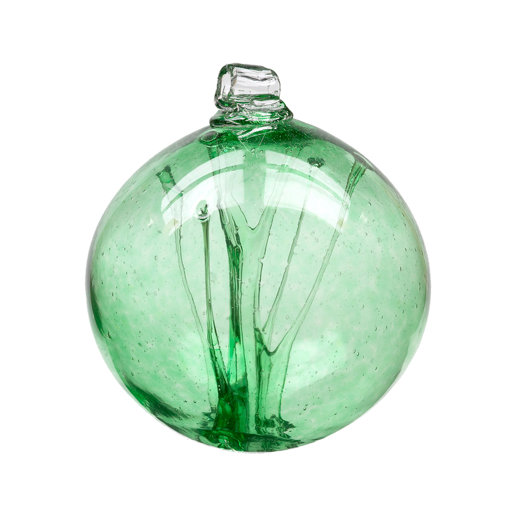 Green glass orb with webbing pulled from bottom to top on a transparent background.