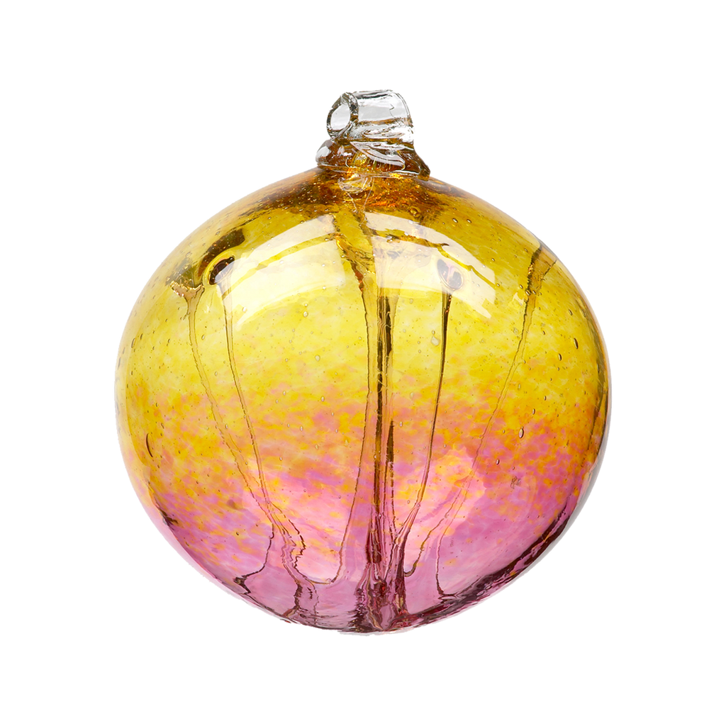 Glass orb with amber glass on top and pink glass on the bottom and webbing pulled from bottom to top on a transparent background.
