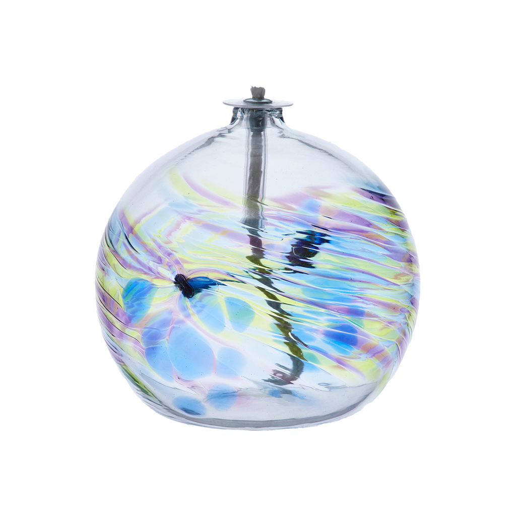 Flat-bottomed glass orb with a wick with purple, green and blue coloured glass around the middle and horizontal webbing on a transparent background.