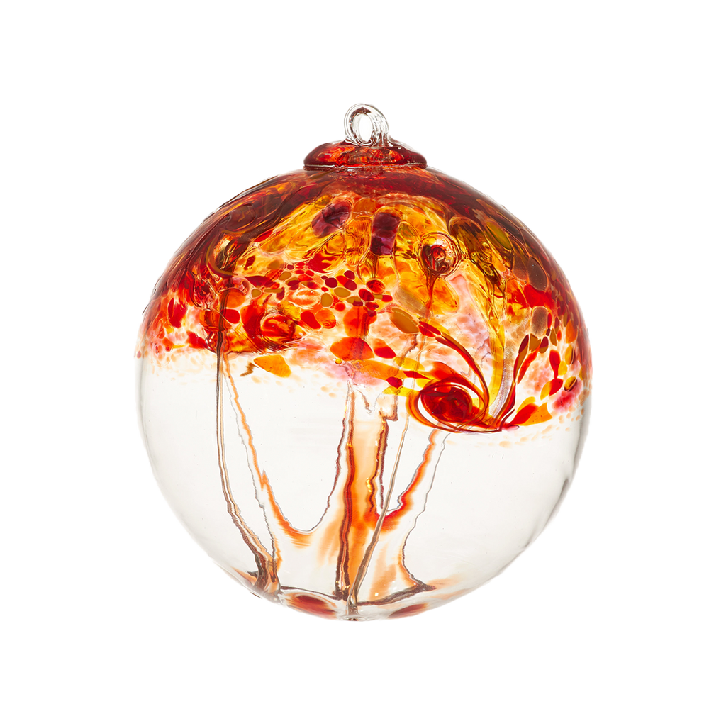 A clear glass orb with red, orange and pink swirled on the top half with red webbing pulled from bottom to top on a transparent background. 