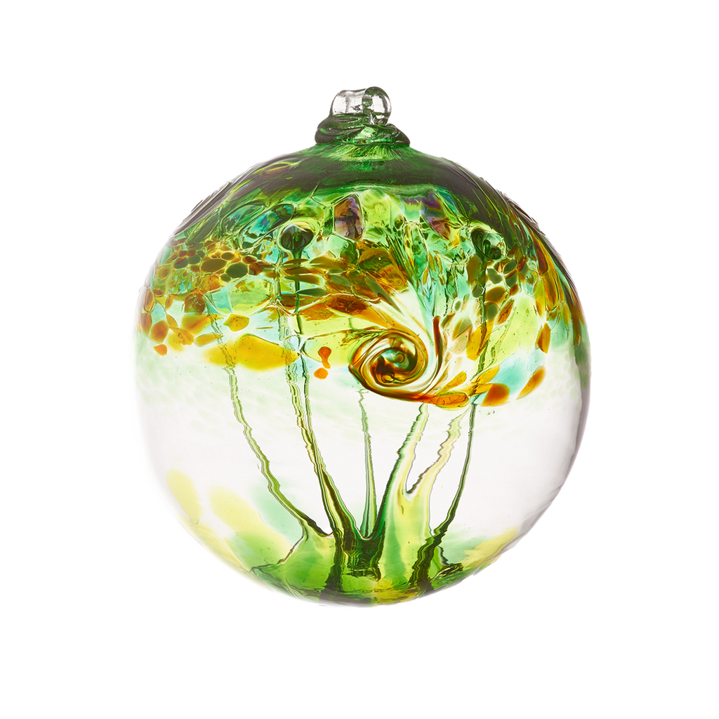 A clear glass orb with green, amber, red and orange swirled on the top half with green webbing pulled from bottom to top on a transparent background.