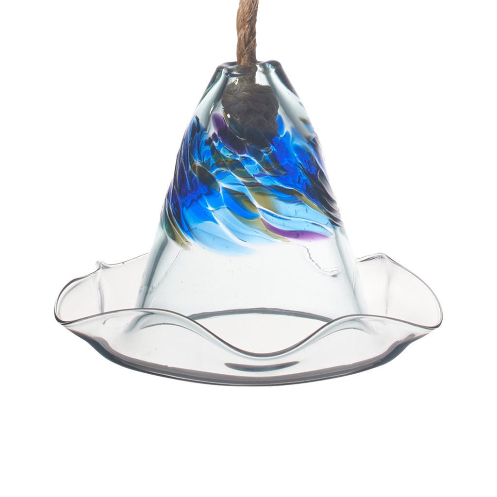 What looks like a glass hat with a ripple brim. The cone of has purple, blue and grey glass swirled into clear glass. A rope comes out of a hole in the top. 