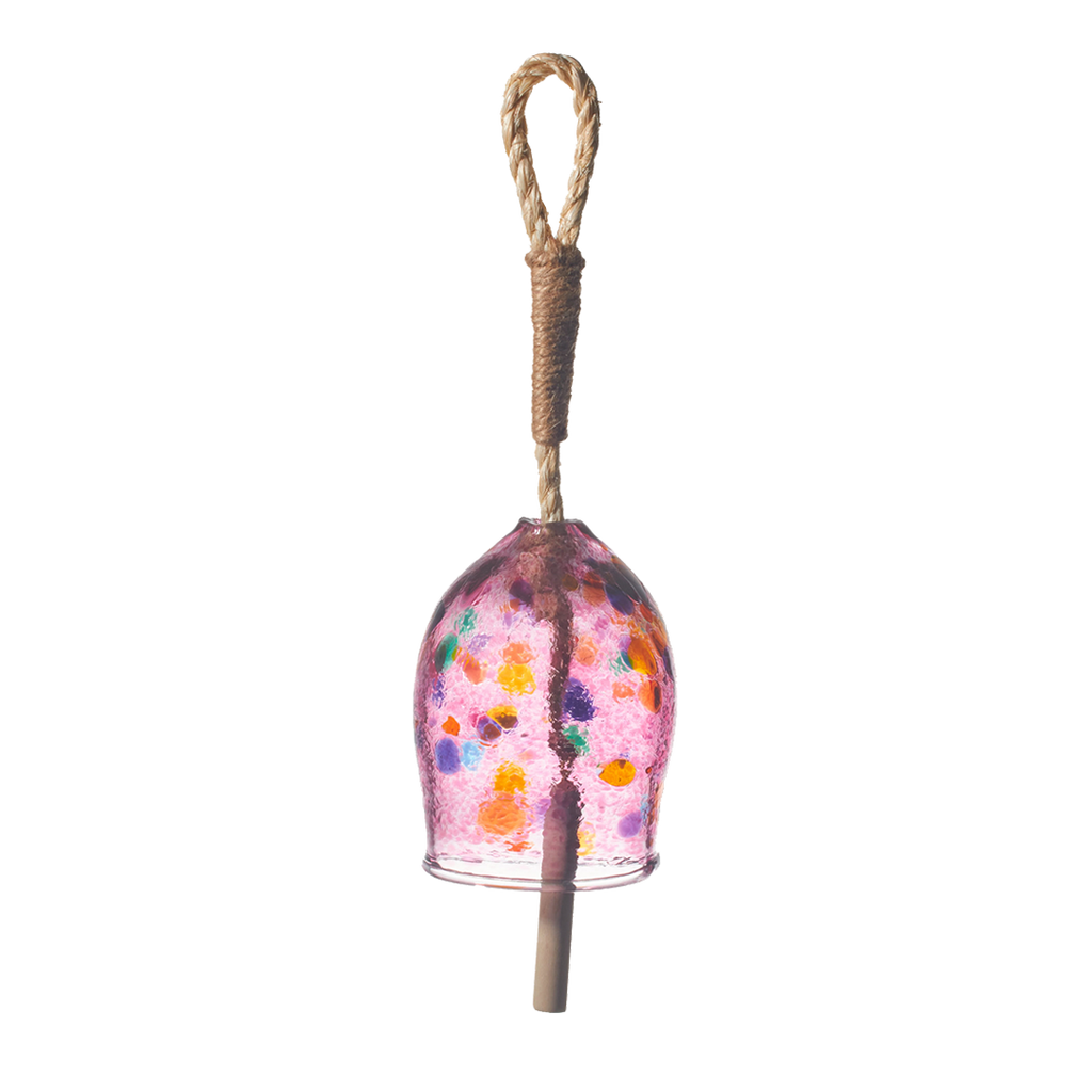 Pink bell with amber, orange, blue, green and purple spots with a rope and wood toggle on a transparent background.