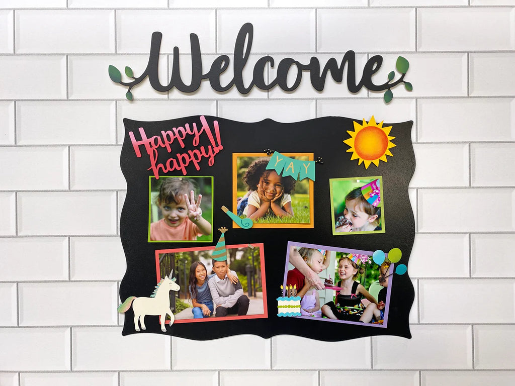 Memo board with pictures and magnets on it with "Welcome" magnet above. 