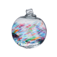 Glass orb with teal, purple, pink, orange, green and blue coloured glass around the middle and horizontal webbing on a transparent background.